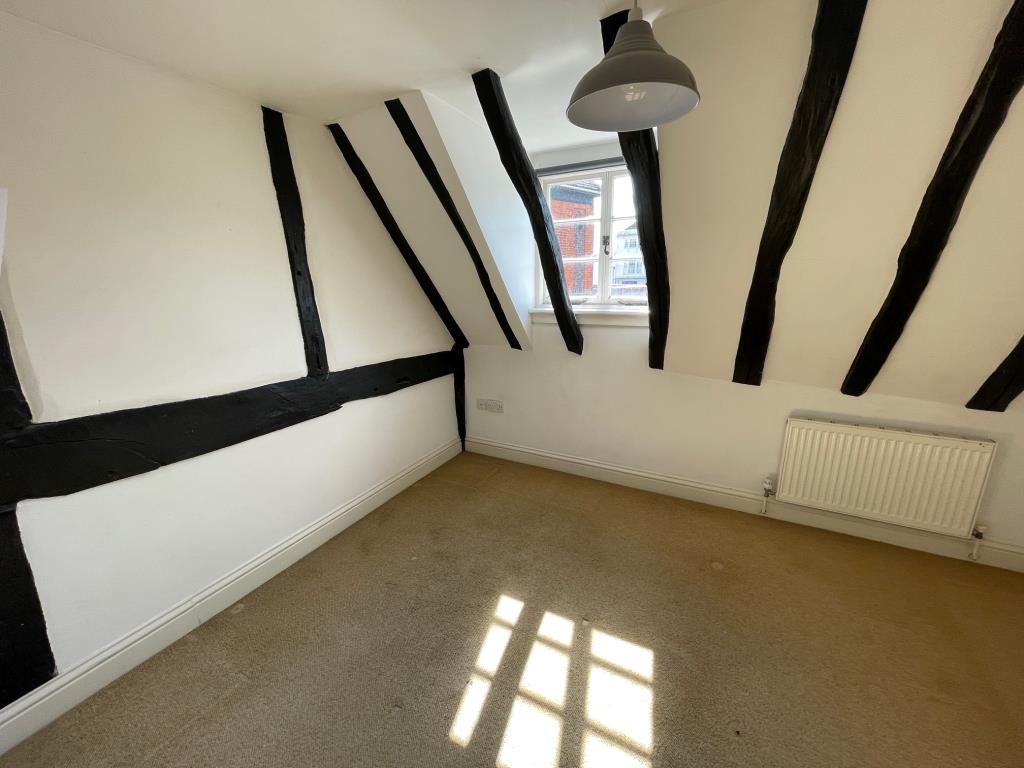 Lot: 122 - VACANT MIXED USE PROPERTY FOR IMPROVEMENT AND SEPARATE COTTAGE TO THE REAR - Bedroom with exposed beams at Warwick Cottage